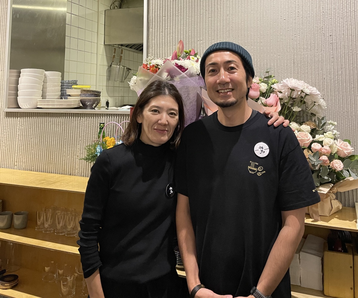 Yuta and Eriko Soma standing together at SOMA Noodle Bar in Tbilisi